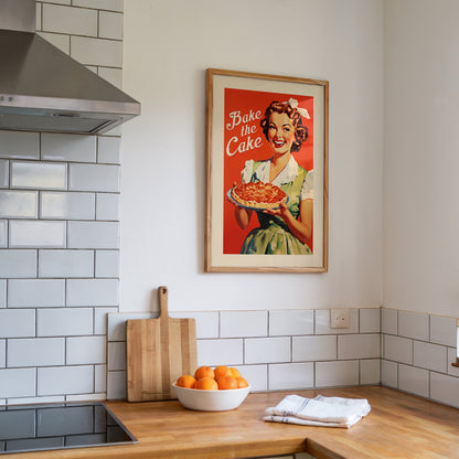 1950s style woman holding a pie with the text “Bake the Cake,” retro baking art poster for breakfast nook and family kitchen decor.