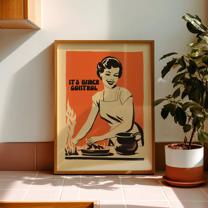 Retro housewife cooking with flames and the text “It’s Under Control,” nostalgic funny kitchen wall art poster for retro cafe or home kitchen decor.