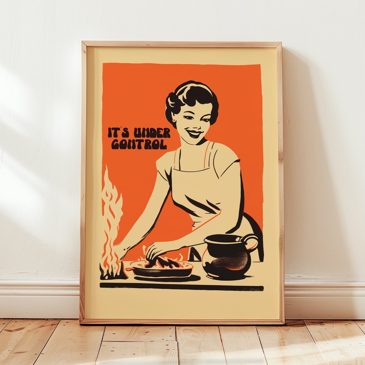 Retro housewife cooking with flames and the text “It’s Under Control,” nostalgic funny kitchen wall art poster for retro cafe or home kitchen decor.