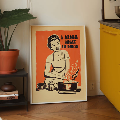 Midcentury housewife cooking over flames with the text “I Know What I’m Doing,” nostalgic retro kitchen wall art print for family kitchen decor.
