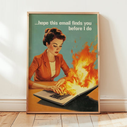 Retro 1950s style woman typing on a flaming laptop with the quote “Hope this email finds you before I do,” funny office wall art for work from home or cubicle decor.