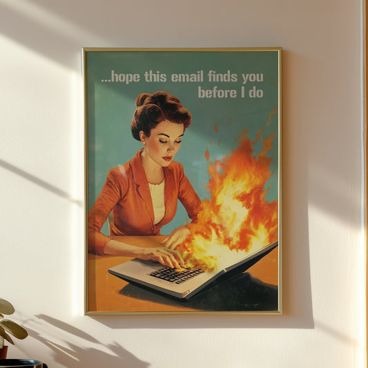 Retro 1950s style woman typing on a flaming laptop with the quote “Hope this email finds you before I do,” funny office wall art for work from home or cubicle decor.