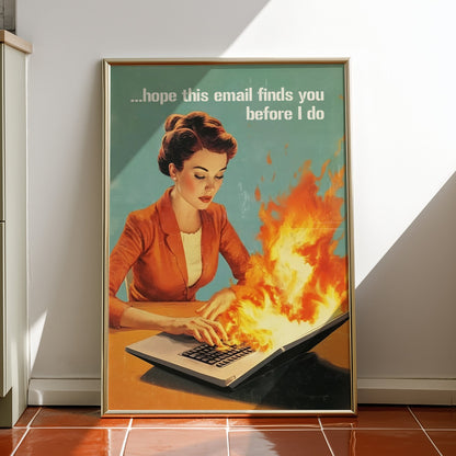 Retro 1950s style woman typing on a flaming laptop with the quote “Hope this email finds you before I do,” funny office wall art for work from home or cubicle decor.
