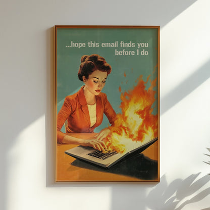 Retro 1950s style woman typing on a flaming laptop with the quote “Hope this email finds you before I do,” funny office wall art for work from home or cubicle decor.