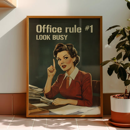 Retro office woman at a desk with the text “Office rule #1 Look Busy,” funny nostalgic office wall art for cubicle or work from home decor.