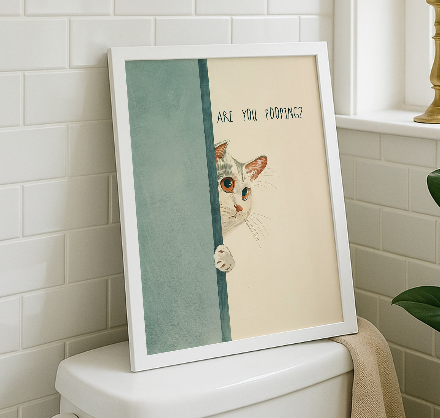 Funny cat bathroom poster hanging on a modern neutral wall above a toilet, showing the relatable "Are You Pooping?" quote.
