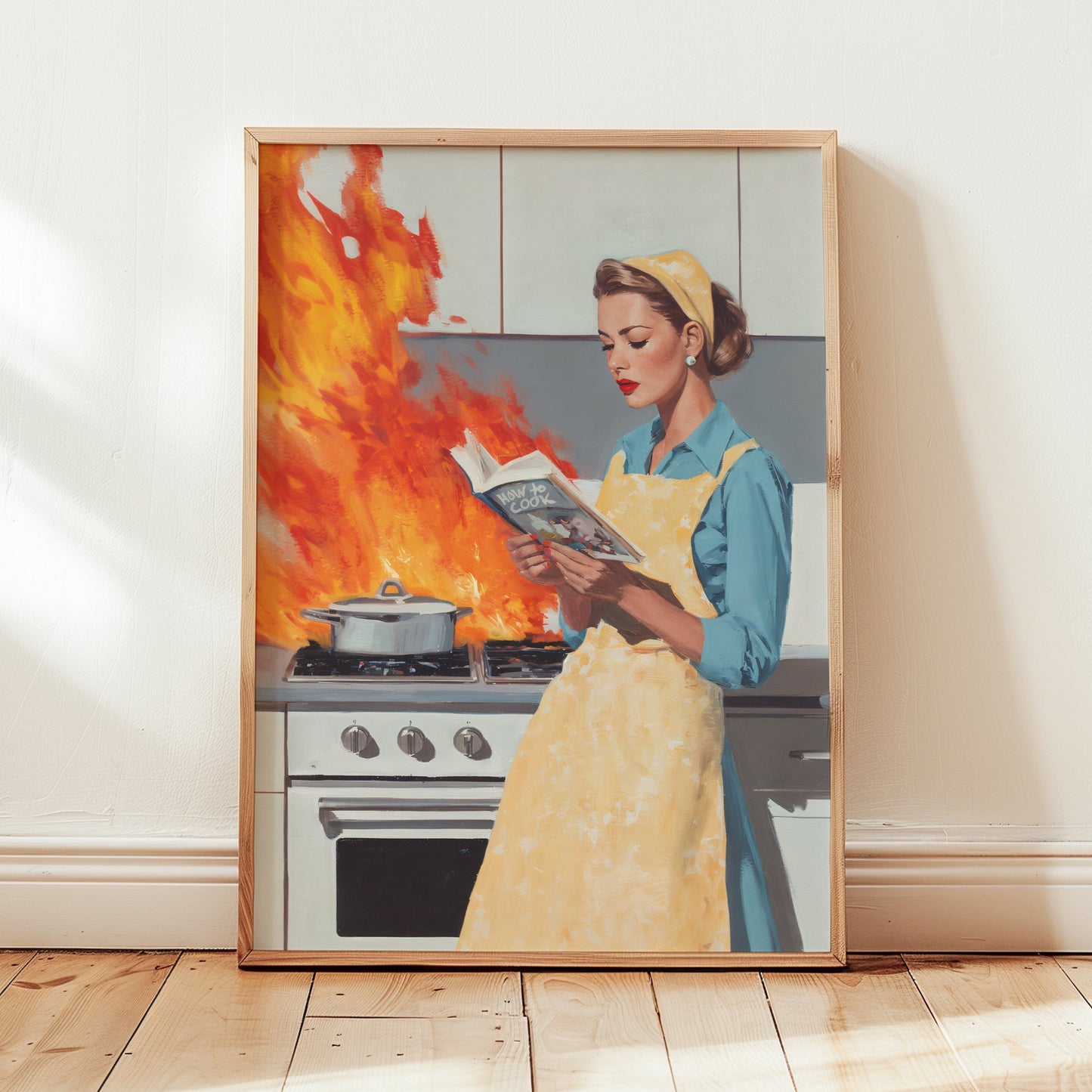 Vintage illustration of a 1950s housewife in a yellow apron calmly reading a cookbook while a fire erupts on a retro stove behind her; funny mid-century modern kitchen wall art.
