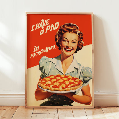 Vintage-style illustration of a smiling 1950s housewife in a blue polka dot dress holding a pie, with the text 'I Have a PhD in Microwaving' on a red and white background; humorous retro kitchen wall art.