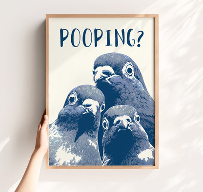Graphic illustration of three blue pigeons staring directly at the viewer with the word 'POOPING?' written in bold blue text above them; funny bathroom wall art.
