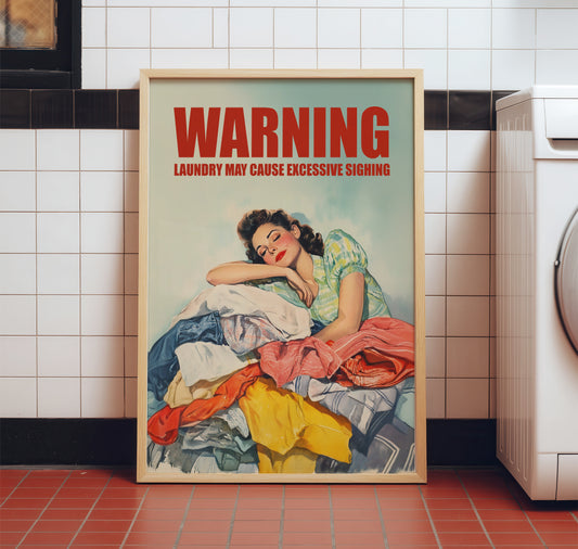 Vintage illustration of a 1950s housewife leaning her head on a large pile of colorful laundry with 'WARNING: LAUNDRY MAY CAUSE EXCESSIVE SIGHING' in bold red text; funny retro laundry room wall art.