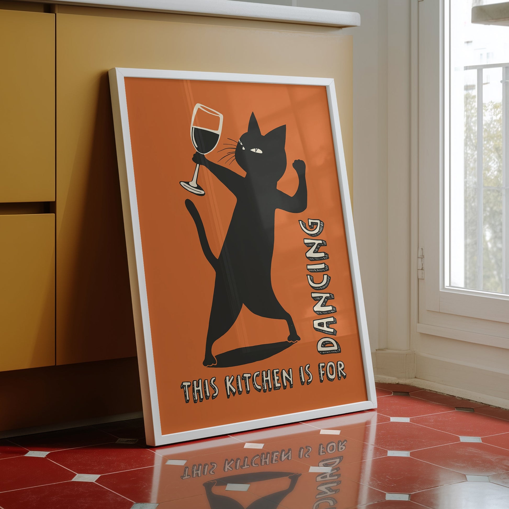 Retro illustration of a sassy black cat dancing while holding a wine glass on a burnt orange background, text reads "This Kitchen is for Dancing" in a vintage font.
