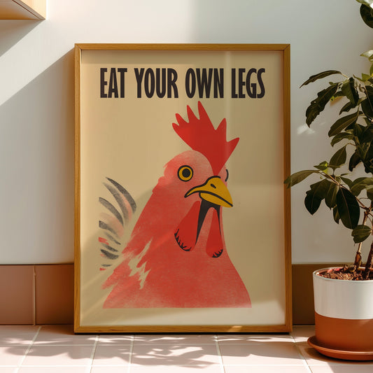 Bold retro illustration of a red chicken rooster with the provocative text "Eat Your Own Legs" in a vintage font, cream background, activist kitchen wall art.
