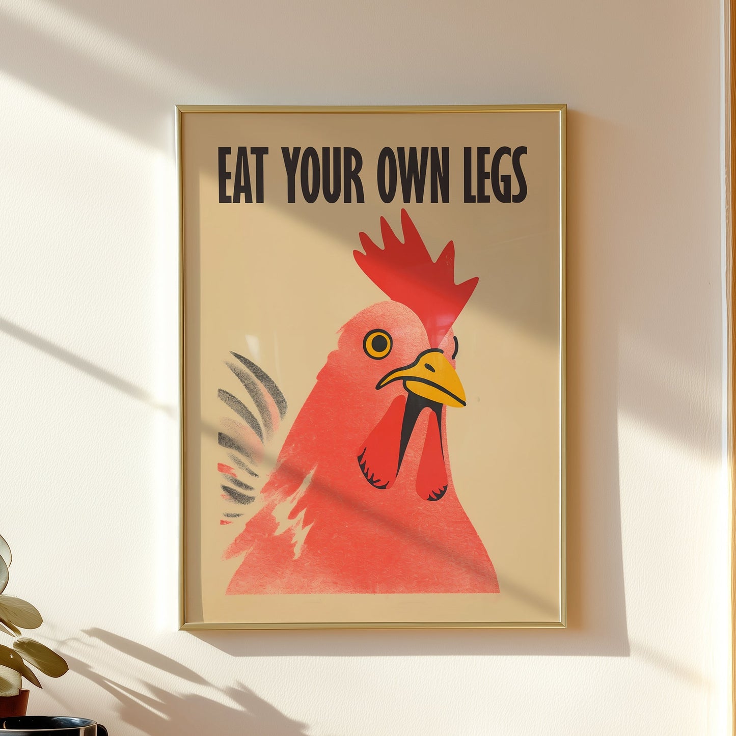 Bold retro illustration of a red chicken rooster with the provocative text "Eat Your Own Legs" in a vintage font, cream background, activist kitchen wall art.
