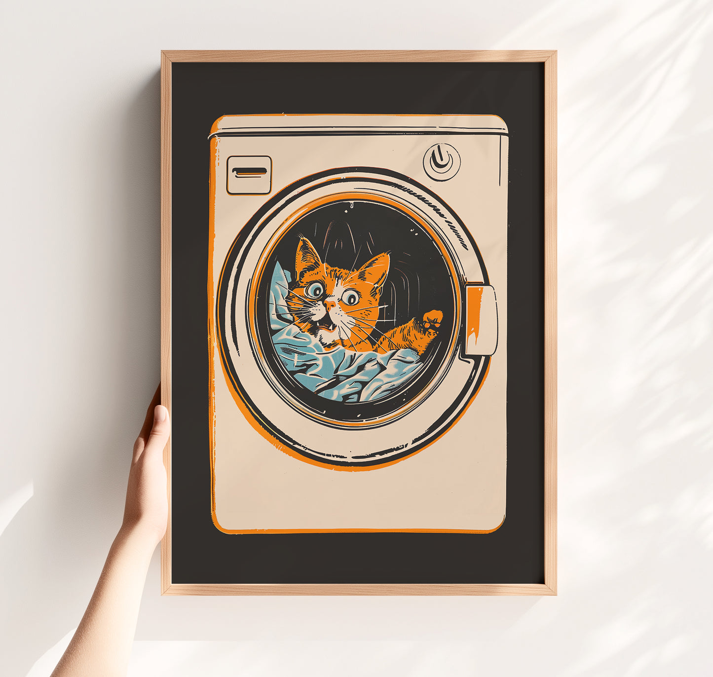 Illustration of a surprised orange tabby cat looking out of a front-loading washing machine, mid-century modern style laundry room wall art.