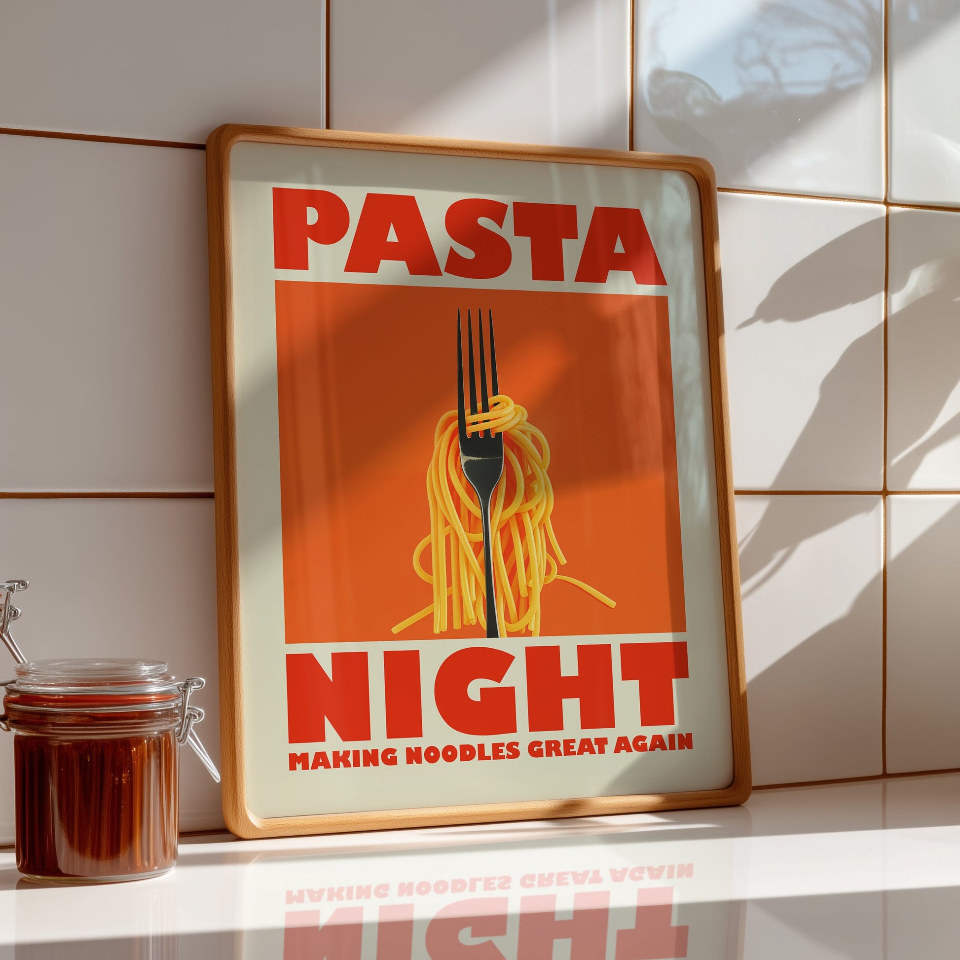 Retro-style kitchen poster with a fork twirling spaghetti on an orange background, featuring the text "Pasta Night" and "Making Noodles Great Again" in bold red letters.
