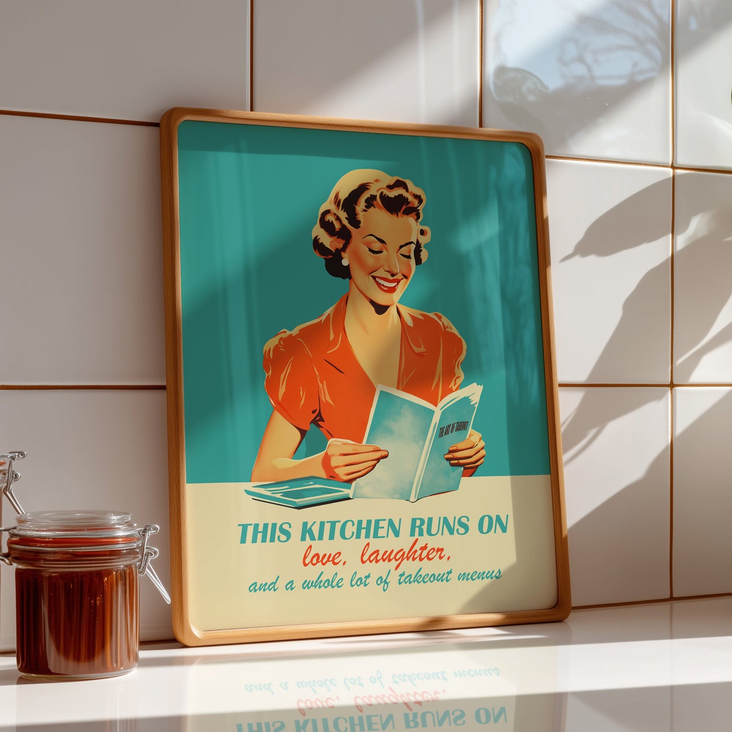 A 1950s-style vintage illustration of a smiling woman in a red dress reading a book. The background is a vibrant teal. Below her is the text: "THIS KITCHEN RUNS ON love, laughter, and a whole lot of takeout menus" in a mix of bold and script typography.