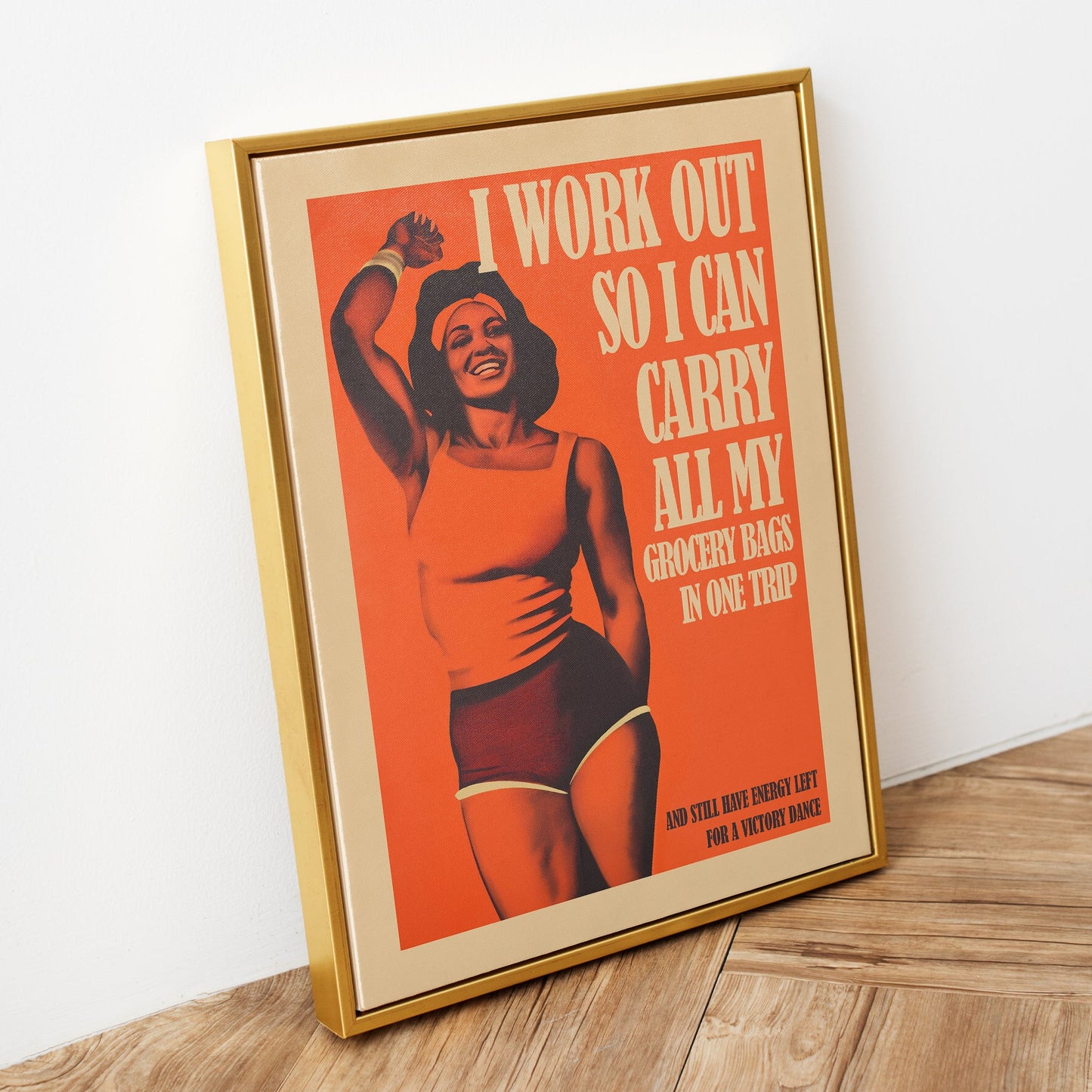 Funny vintage-style gym poster featuring a smiling Black woman in athletic wear with the text "I work out so I can carry all my grocery bags in one trip and still have energy left for a victory dance."
