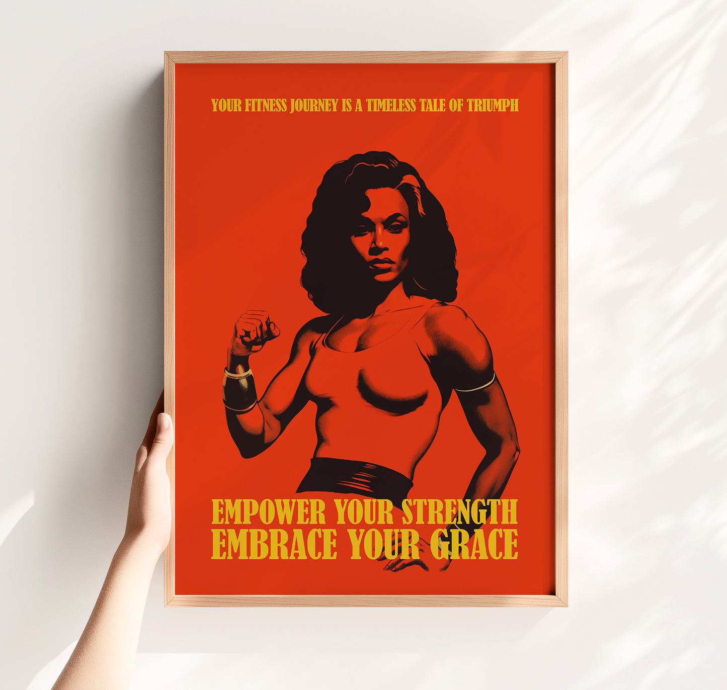 Motivational gym poster with a bold red background featuring a muscular Black woman and the quotes "Empower Your Strength Embrace Your Grace" and "Your fitness journey is a timeless tale of triumph."
