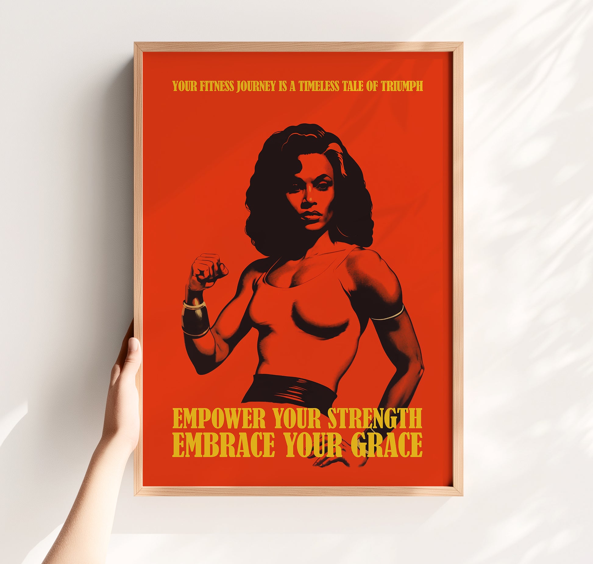 Motivational gym poster with a bold red background featuring a muscular Black woman and the quotes "Empower Your Strength Embrace Your Grace" and "Your fitness journey is a timeless tale of triumph."
