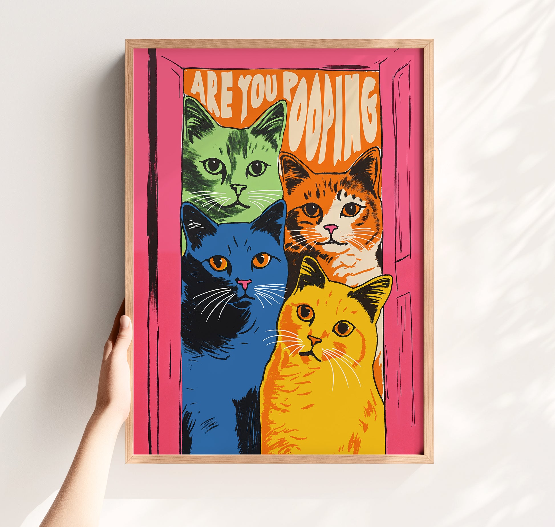Funny 'Are You Pooping' cat poster with four colorful green, orange, blue, and yellow cats in a pink doorway, retro maximalist bathroom wall art matte print.