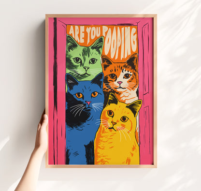 Funny 'Are You Pooping' cat poster with four colorful green, orange, blue, and yellow cats in a pink doorway, retro maximalist bathroom wall art matte print.