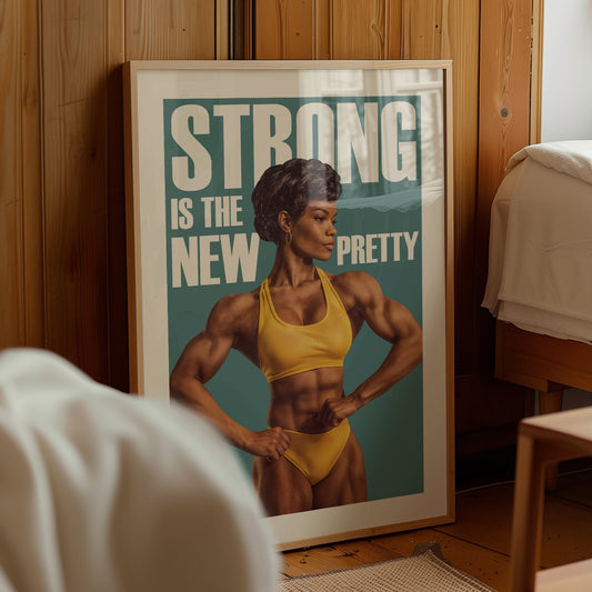 Vintage-style fitness poster featuring a muscular Black woman in a yellow sports bra and shorts with the text "STRONG IS THE NEW PRETTY" in a retro 1970s bodybuilding illustration style.