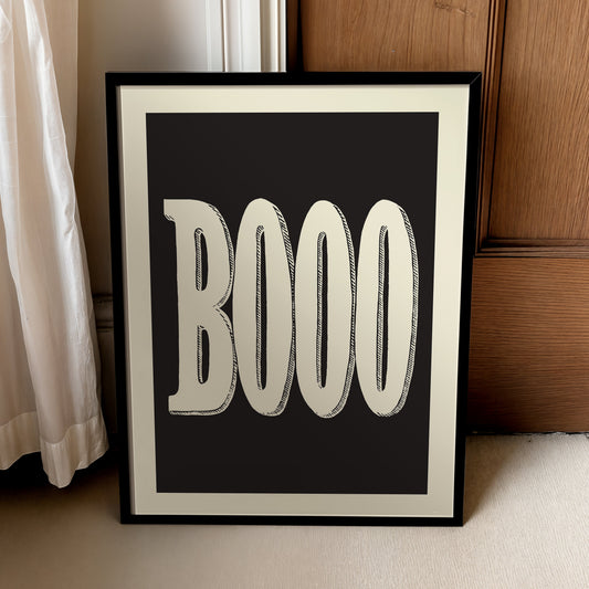 Minimalist BOOO Halloween poster with oversized cream typography on a solid black background, designed as black-and-white spooky quote wall art.