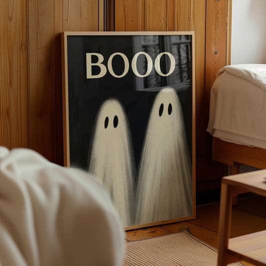 Cute minimalist Halloween ghost poster with two white sheet ghosts and large BOOO lettering on a black background, designed as playful spooky wall art.