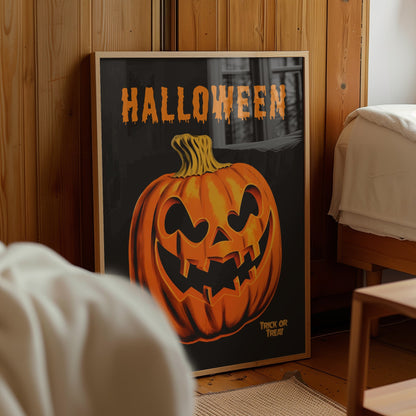 A framed Halloween art print leaning against a wooden wall in a bedroom. The print features a carved orange jack-o'-lantern pumpkin on a dark background with the word 'HALLOWEEN' in orange at the top and 'TRICK OR TREAT' at the bottom right.