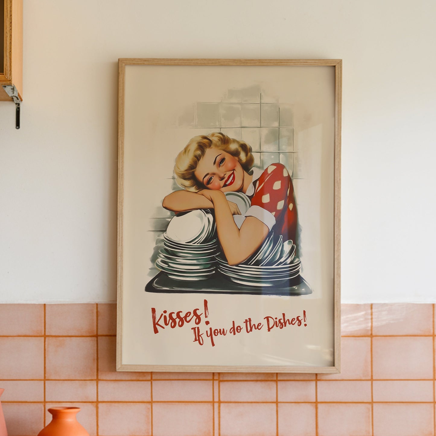 Retro housewife leaning on stacked dishes with the quote “Kisses If You Do the Dishes,” nostalgic funny kitchen wall art print for kitchen nook decor, funny roommate gift idea.