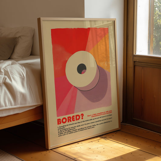 “Bored?” toilet facts poster displayed in a wooden frame beside a bed and window.
